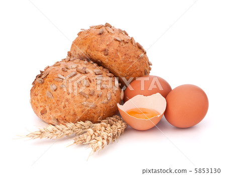 Bun with seeds and broken egg Bun with seeds and broken egg 5853130