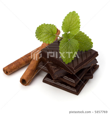 Chocolate bars stack and cinnamon sticks Chocolate bars stack and cinnamon sticks 5857769