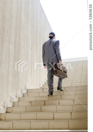 Businessman with stair in business concept 5860636