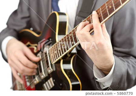Businessman playing the guitar on white 5860770