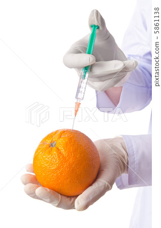 Science experiment with orange and syringe 5861138