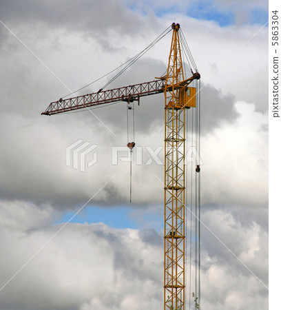 yellow crane and blue sky on building site 5863304