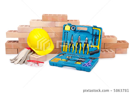 Construction concept with helmet and toolkit Construction concept with helmet and toolkit 5863781