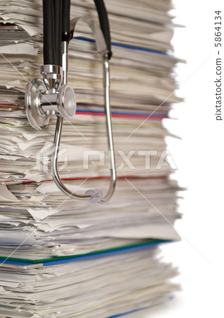 Stack of papers with stethoscope Stack of papers with stethoscope 5864134