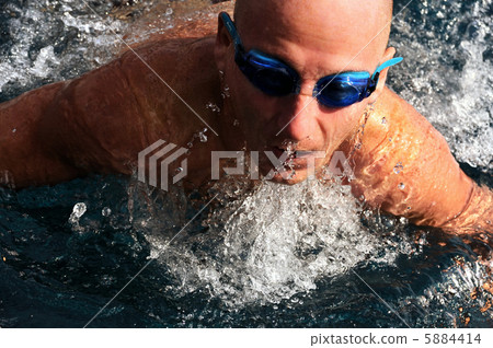 Detail of young man swimming 5884414