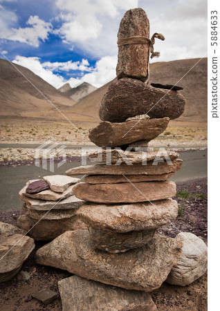 Highland road pass in Himalaya mountains with stone pyramid. Ind Highland road pass in Himalaya mountains with stone pyramid. Ind 5884633