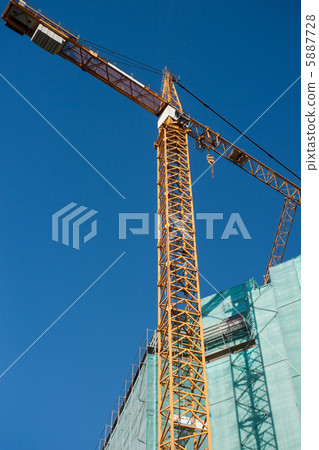 Construction site: crane and unfinished buiding Construction site: crane and unfinished buiding 5887728