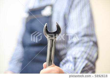 A man with a wrench 5892618