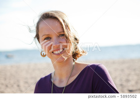 Happy smiling woman at beach. Happy smiling woman at beach. 5893502