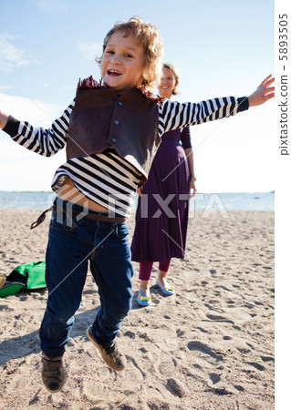 Boy jumping at beach Boy jumping at beach 5893505