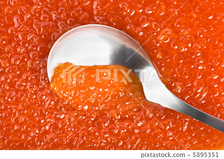 Spoon into red caviar 5895351