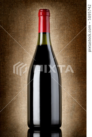 Bottle of wine on the old background Bottle of wine on the old background 5895742