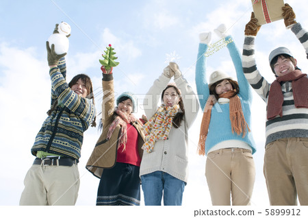 Young people with Christmas goods Young people with Christmas goods 5899912