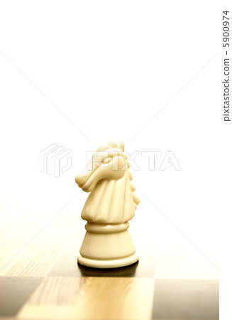 Knight figure on chessboard Knight figure on chessboard 5900974