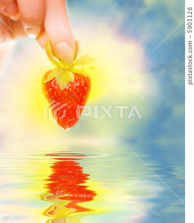 Woman's hand with a fresh strawberry Woman's hand with a fresh strawberry 5901128