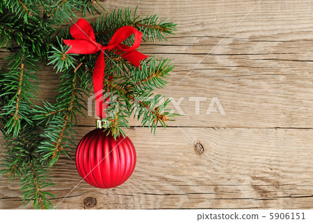 Spruce branches with christmas decoration on wooden background Spruce branches with christmas decoration on wooden background 5906151