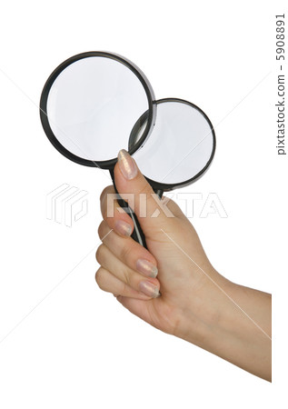 Hand holding magnifying glass on white 5908891