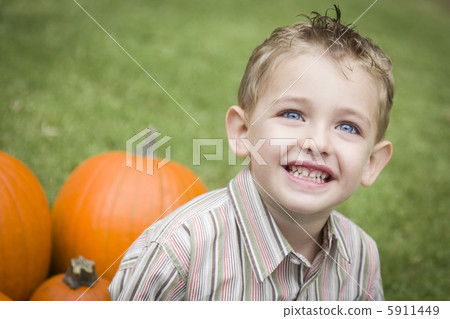 Cure Young Child Boy Enjoying the Pumpkin Patch. Cure Young Child Boy Enjoying the Pumpkin Patch. 5911449