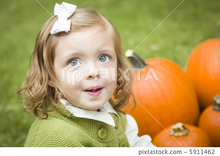 Cure Young Child Girl Enjoying the Pumpkin Patch. Cure Young Child Girl Enjoying the Pumpkin Patch. 5911462
