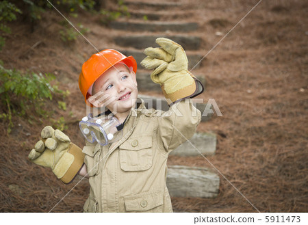 Adorable Child Boy with Big Gloves Playing Handyman Outside Adorable Child Boy with Big Gloves Playing Handyman Outside 5911473