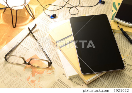 Tablet and glasses on the desk and smartphone 5921022