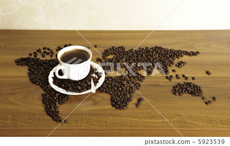 Dramatic photo of world map made of coffee beans. White cup with Dramatic photo of world map made of coffee beans. White cup with 5923539
