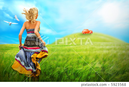 Young woman running across the field to the car on a hill. Dream Young woman running across the field to the car on a hill. Dream 5923568