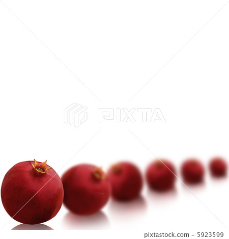 Bright red pomegranates isolated on white background with beauti 5923599
