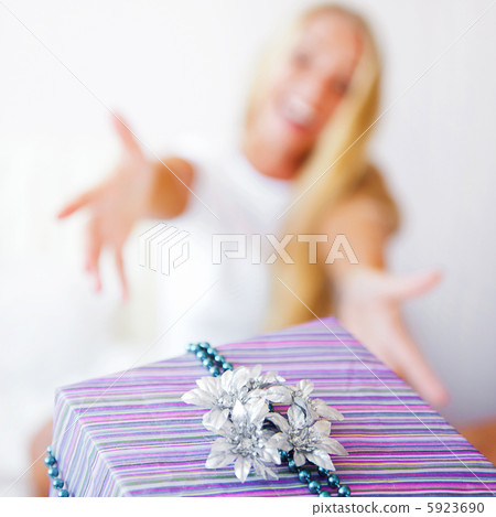 Boyfriend making a gift to his girlfriend in the morning. She is 5923690