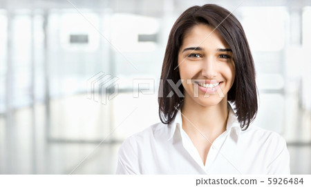 Young business woman in an office Young business woman in an office 5926484