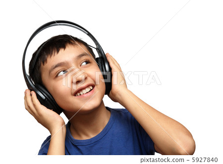 boy listening music in headphones boy listening music in headphones 5927840