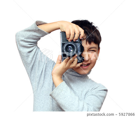 boy photographing vertical with black slr camera boy photographing vertical with black slr camera 5927866