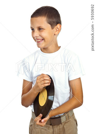 Boy in white shirt holding vinyl record Boy in white shirt holding vinyl record 5930692
