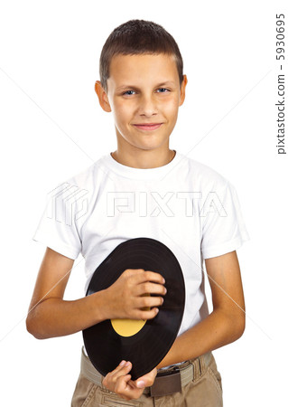 Boy in white shirt holding vinyl record Boy in white shirt holding vinyl record 5930695