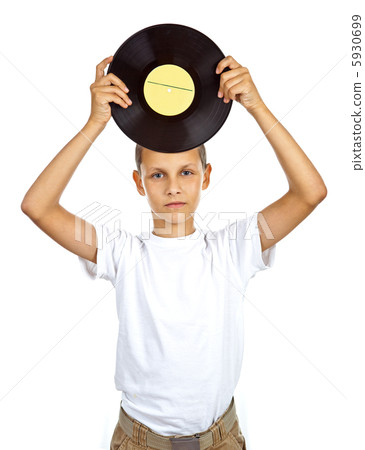 Boy in white shirt holding vinyl record Boy in white shirt holding vinyl record 5930699