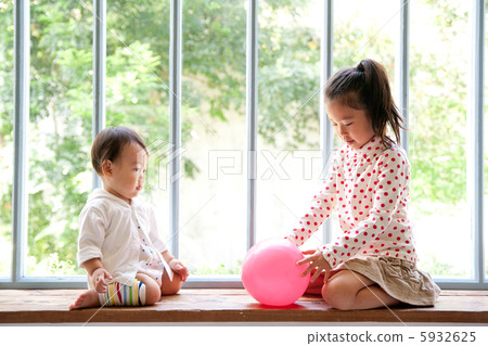 Sisters playing in the living room Sisters playing in the living room 5932625