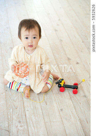 Baby playing in the living room Baby playing in the living room 5932626