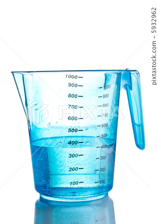 Blue measuring cup filled with water Blue measuring cup filled with water 5932962