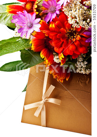 Flowers and golden colored envelope Flowers and golden colored envelope 5933709