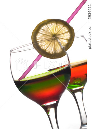 Rainbow colored drinks with straw and lemon Rainbow colored drinks with straw and lemon 5934611