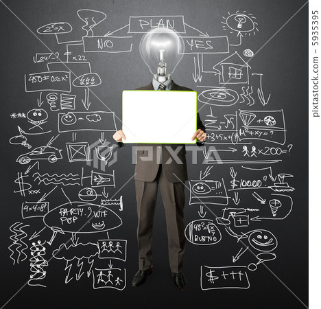 happy businessman with lamp-head holding card 5935395