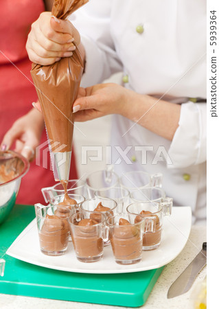 chef making a chocolate mousse chef making a chocolate mousse 5939364