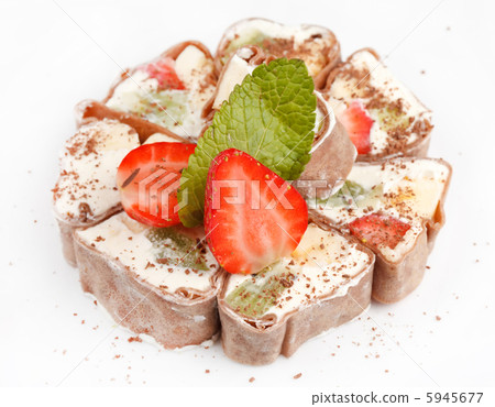 Tiramisu Sushi Roll garnished with Strawberry and Mint Tiramisu Sushi Roll garnished with Strawberry and Mint 5945677