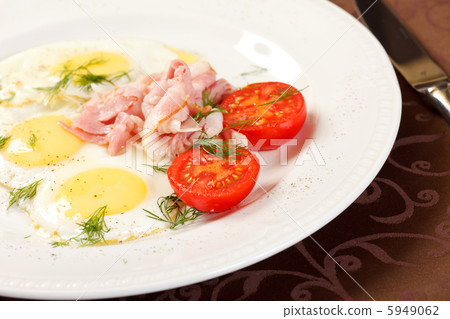 fried eggs with bacon and vegetables fried eggs with bacon and vegetables 5949062