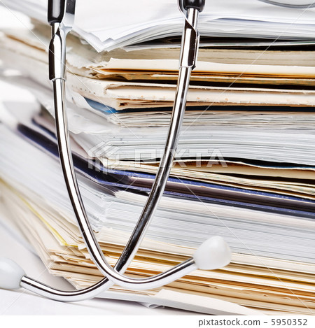 stethoscope on the stack of paper stethoscope on the stack of paper 5950352