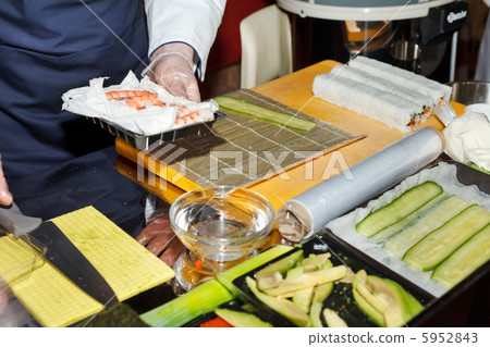 chef preparing sushi in the kitchen chef preparing sushi in the kitchen 5952843