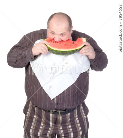 Obese man eating watermelon Obese man eating watermelon 5954558