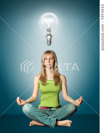 woman meditation in lotus pose with bulb woman meditation in lotus pose with bulb 5954810