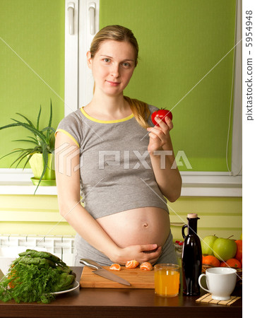 Pregnant Woman On Kitchen Pregnant Woman On Kitchen 5954948