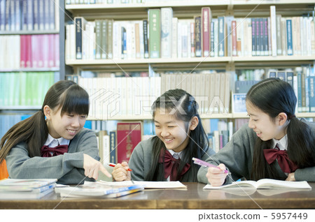 Junior high school students studying in the library 5957449